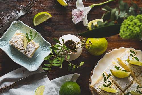 citrus fruit sliced lemon on white ceramic plate lime
